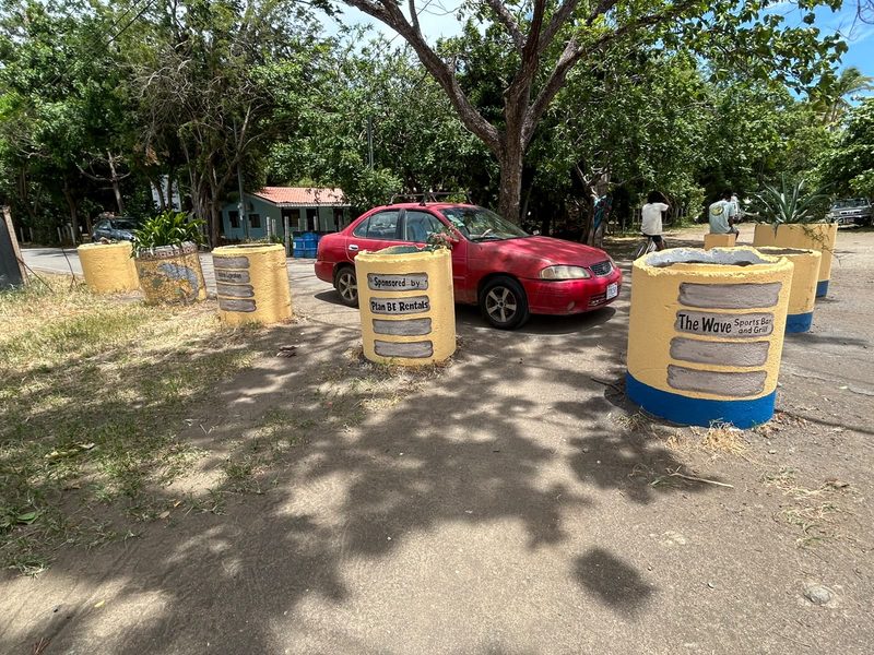 Painted barrels in Coco carrying sponsor plaques